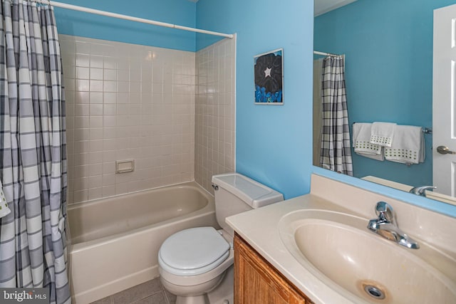 full bathroom with vanity, tile patterned flooring, toilet, and shower / bath combo with shower curtain