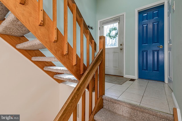 foyer entrance featuring light tile patterned flooring