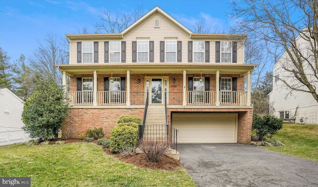 view of front of home featuring driveway, a porch, a front yard, a garage, and brick siding