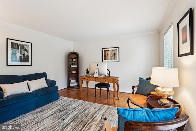 living room with crown molding and wood finished floors