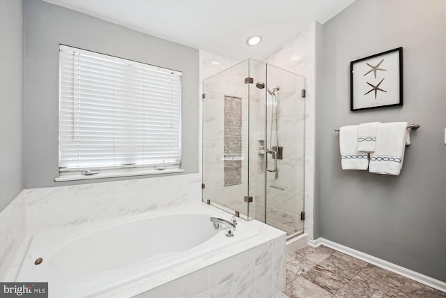 bathroom with recessed lighting, a stall shower, baseboards, and a garden tub