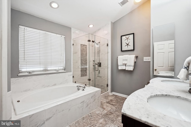 full bath featuring visible vents, a sink, a shower stall, double vanity, and a bath