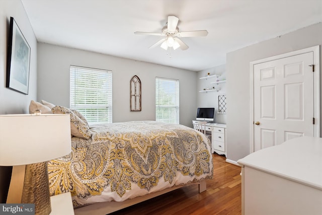 bedroom featuring a ceiling fan and wood finished floors