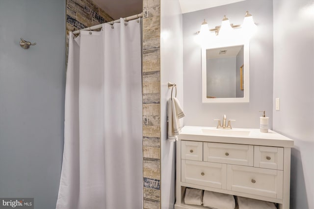 bathroom with vanity and a shower with curtain