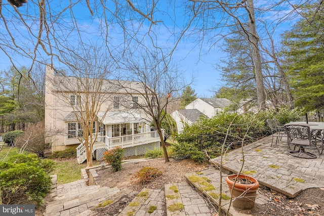 view of yard with stairs and a patio area