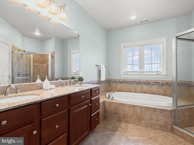 bathroom featuring vanity, tile patterned floors, and shower with separate bathtub