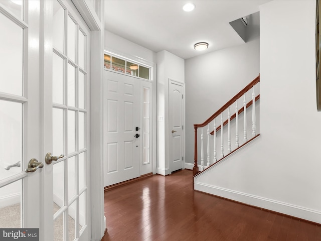 foyer with dark hardwood / wood-style flooring