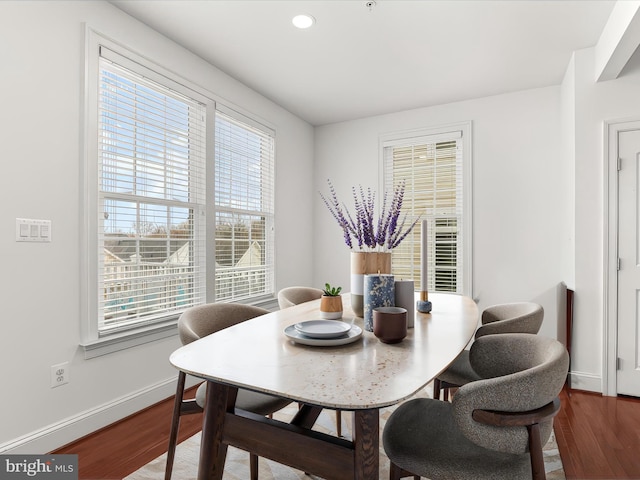 dining area with dark wood-type flooring