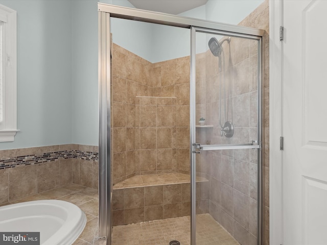 bathroom featuring plus walk in shower