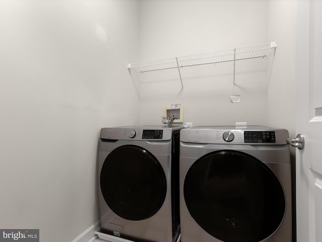 washroom with washer and clothes dryer