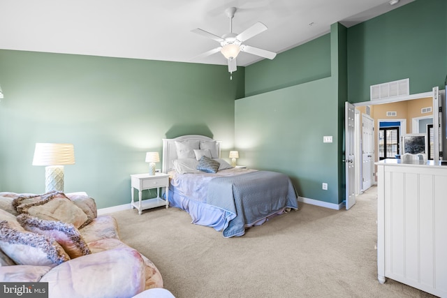 bedroom featuring high vaulted ceiling, baseboards, and light colored carpet