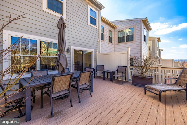 wooden deck featuring outdoor dining area