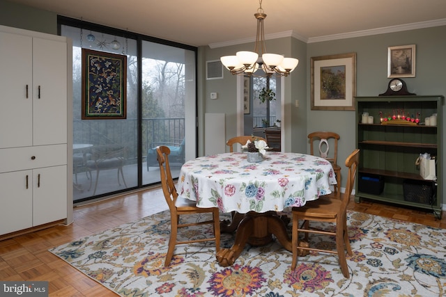 dining area with light parquet floors, ornamental molding, floor to ceiling windows, and an inviting chandelier