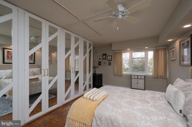 bedroom with french doors and dark parquet floors