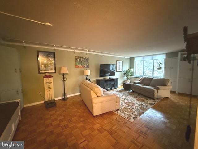 living room featuring parquet flooring