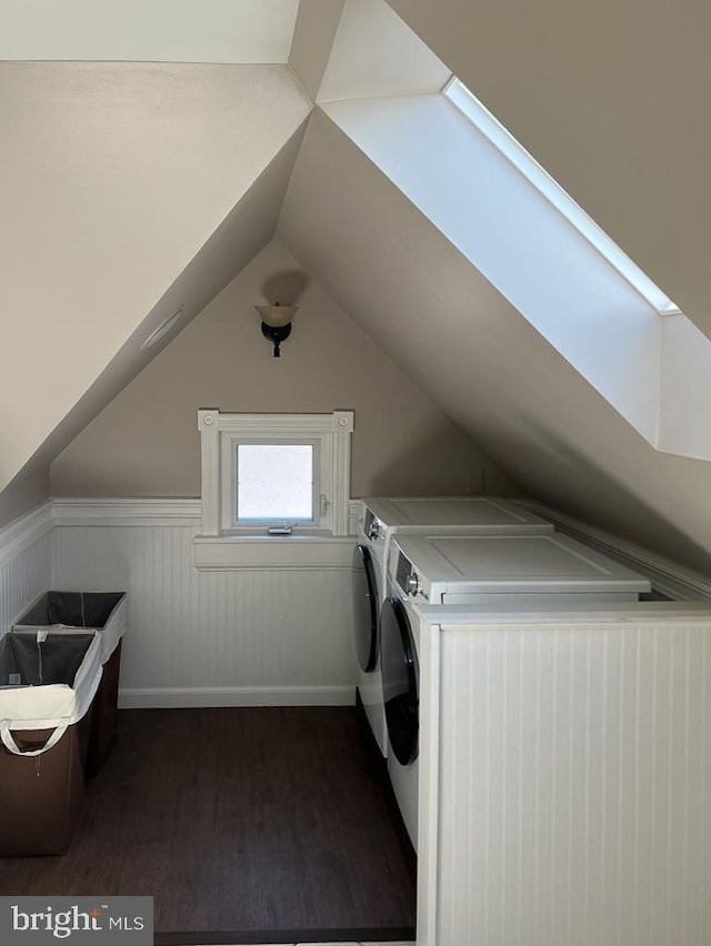 laundry room featuring separate washer and dryer and dark hardwood / wood-style floors