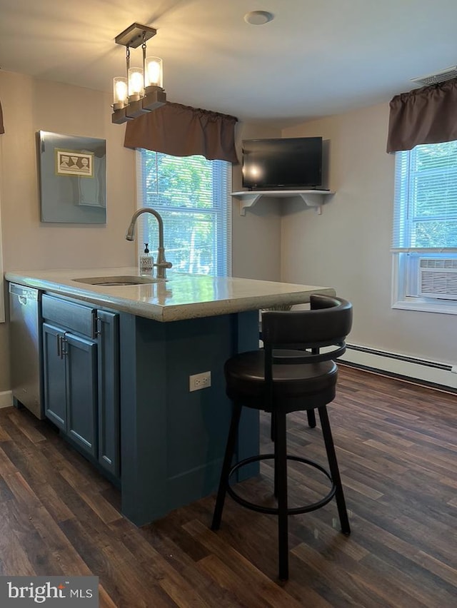 kitchen featuring decorative light fixtures, a baseboard radiator, sink, dark hardwood / wood-style flooring, and stainless steel dishwasher