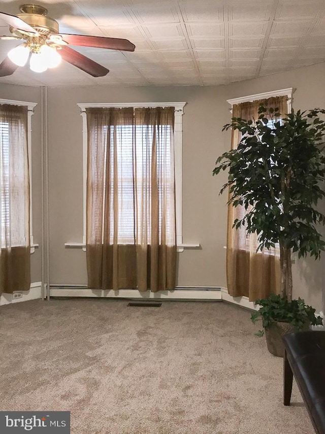 empty room with carpet and ceiling fan