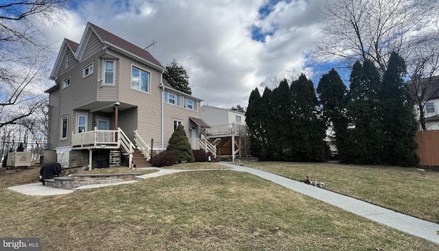 exterior space with a front yard and a patio