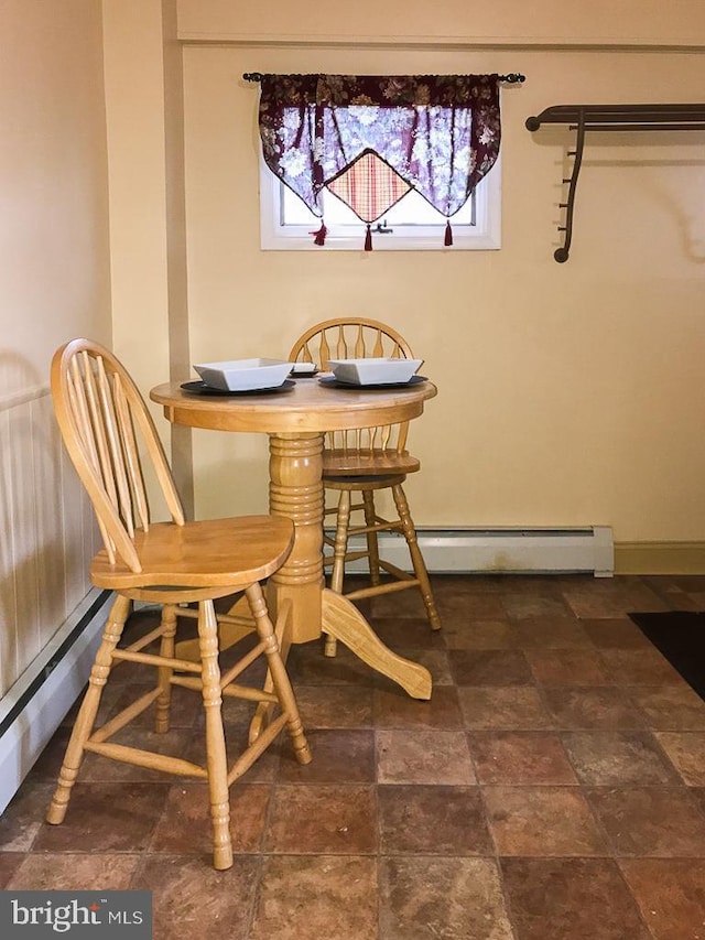 dining room with a baseboard radiator