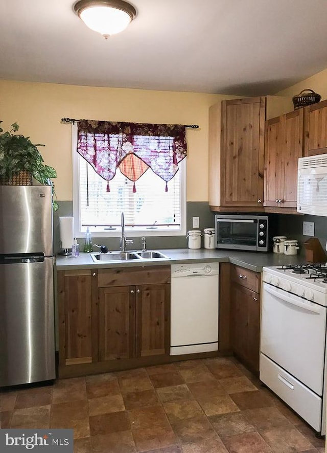 kitchen with sink and white appliances