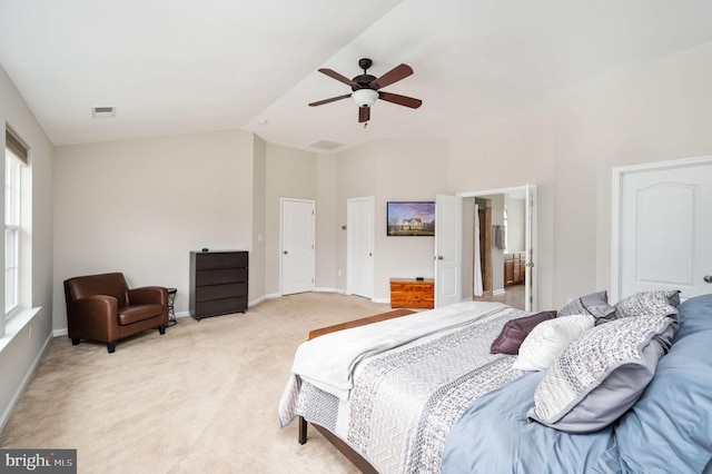 bedroom with light carpet, visible vents, baseboards, and vaulted ceiling