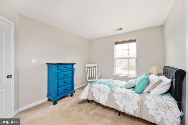 bedroom featuring visible vents, carpet floors, and baseboards