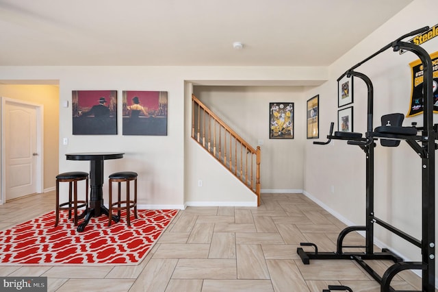 exercise room with baseboards