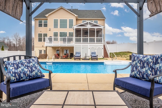 view of swimming pool featuring a fenced backyard, stairway, a fenced in pool, and a patio