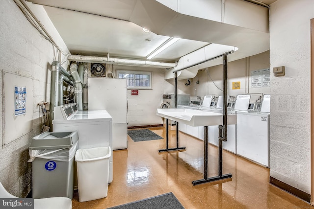 clothes washing area featuring washing machine and dryer