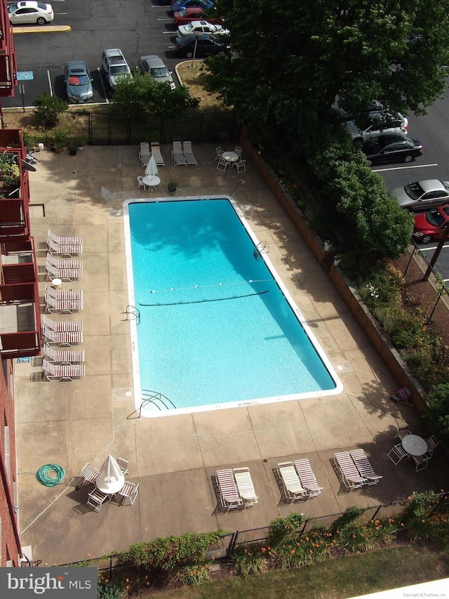 view of swimming pool with a patio