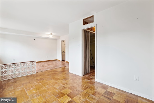 spare room with light parquet floors