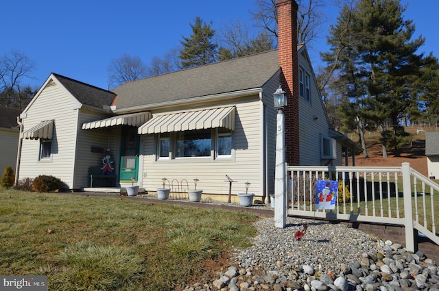 bungalow-style house with a front yard