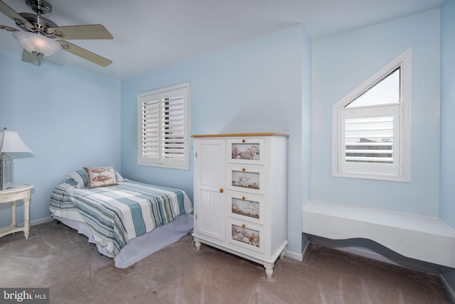 carpeted bedroom featuring ceiling fan