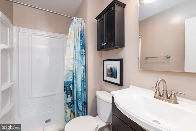 bathroom with vanity, toilet, and a shower with shower curtain