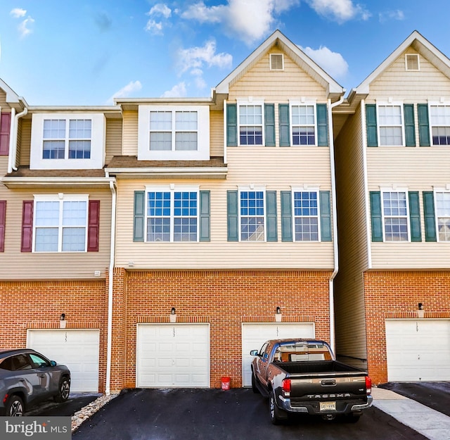 multi unit property featuring a garage