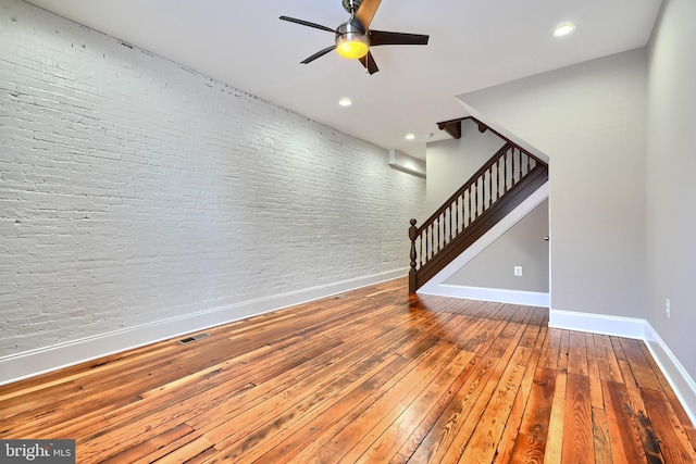 interior space featuring hardwood / wood-style floors and ceiling fan