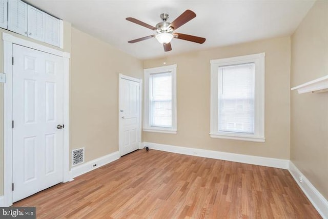 unfurnished bedroom featuring ceiling fan and light hardwood / wood-style floors