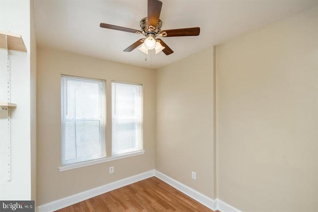 empty room featuring hardwood / wood-style flooring and ceiling fan