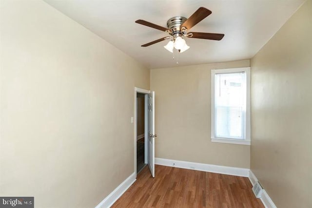 unfurnished bedroom featuring hardwood / wood-style flooring and ceiling fan