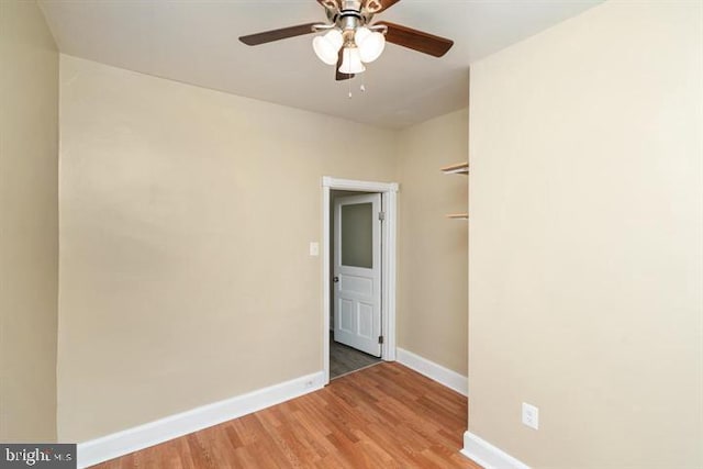 empty room featuring hardwood / wood-style floors and ceiling fan