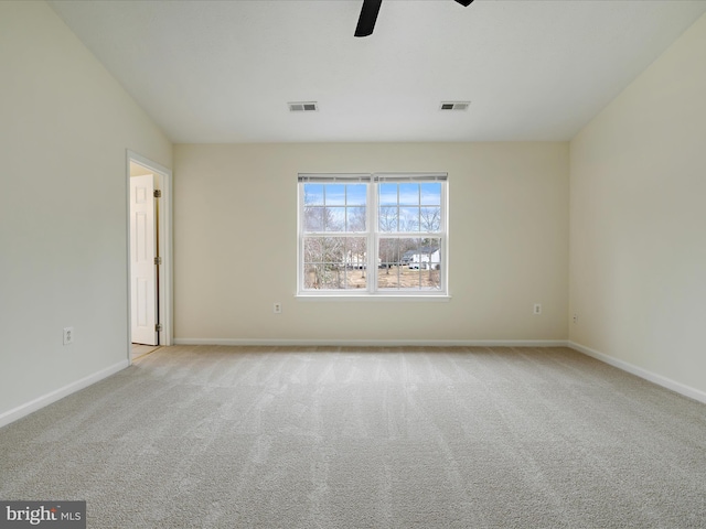 unfurnished room featuring ceiling fan and light carpet