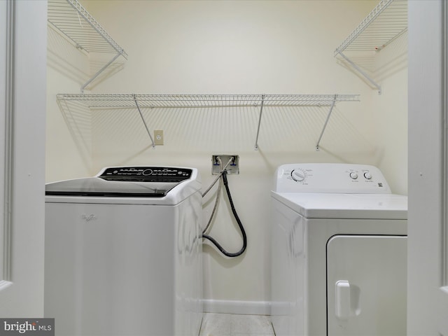 laundry area with separate washer and dryer