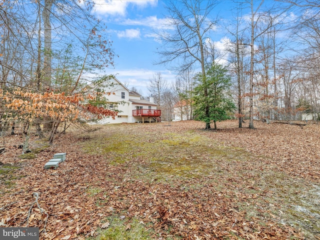 view of yard featuring a wooden deck