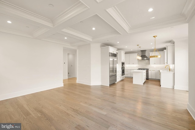 unfurnished living room with light wood-style flooring, beam ceiling, coffered ceiling, and crown molding