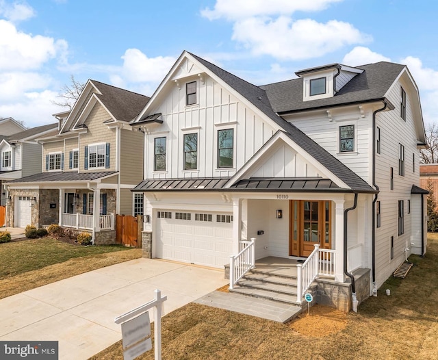 view of front of home featuring concrete driveway, roof with shingles, a standing seam roof, a porch, and board and batten siding