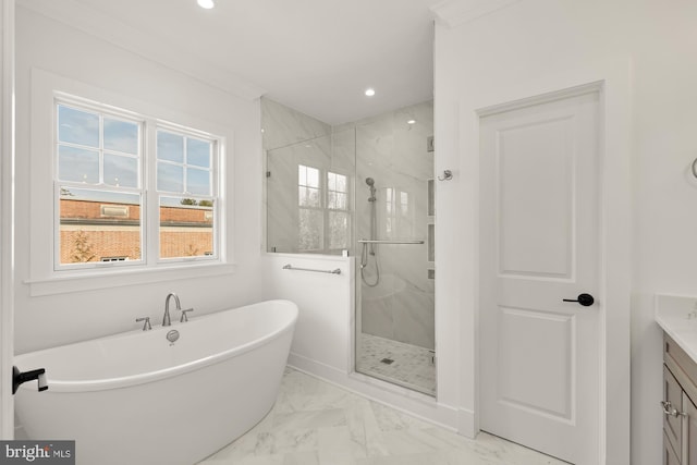 bathroom with recessed lighting, marble finish floor, a freestanding tub, and a marble finish shower