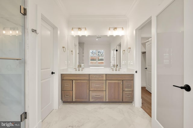 full bathroom with double vanity, crown molding, and a sink