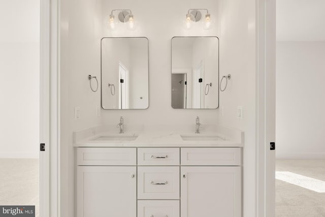 bathroom with double vanity and a sink