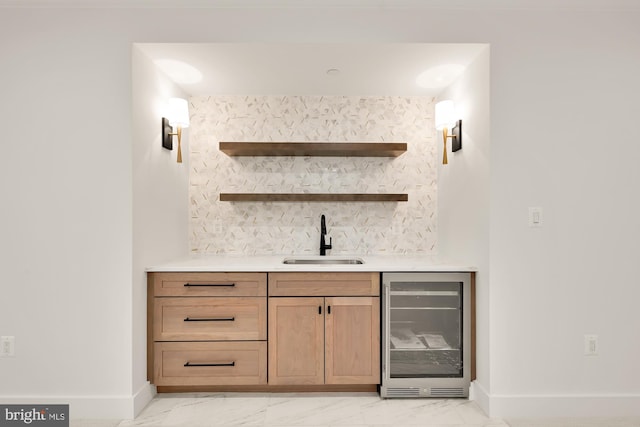 bar featuring marble finish floor, wine cooler, indoor wet bar, and a sink